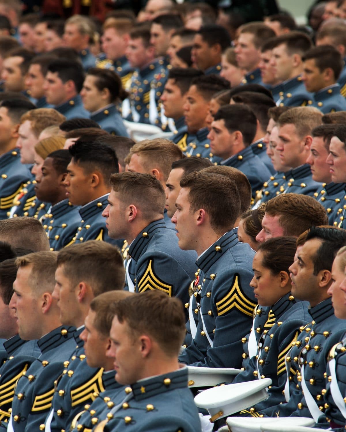 Rows of cadets in dress gray at a West Point graduation