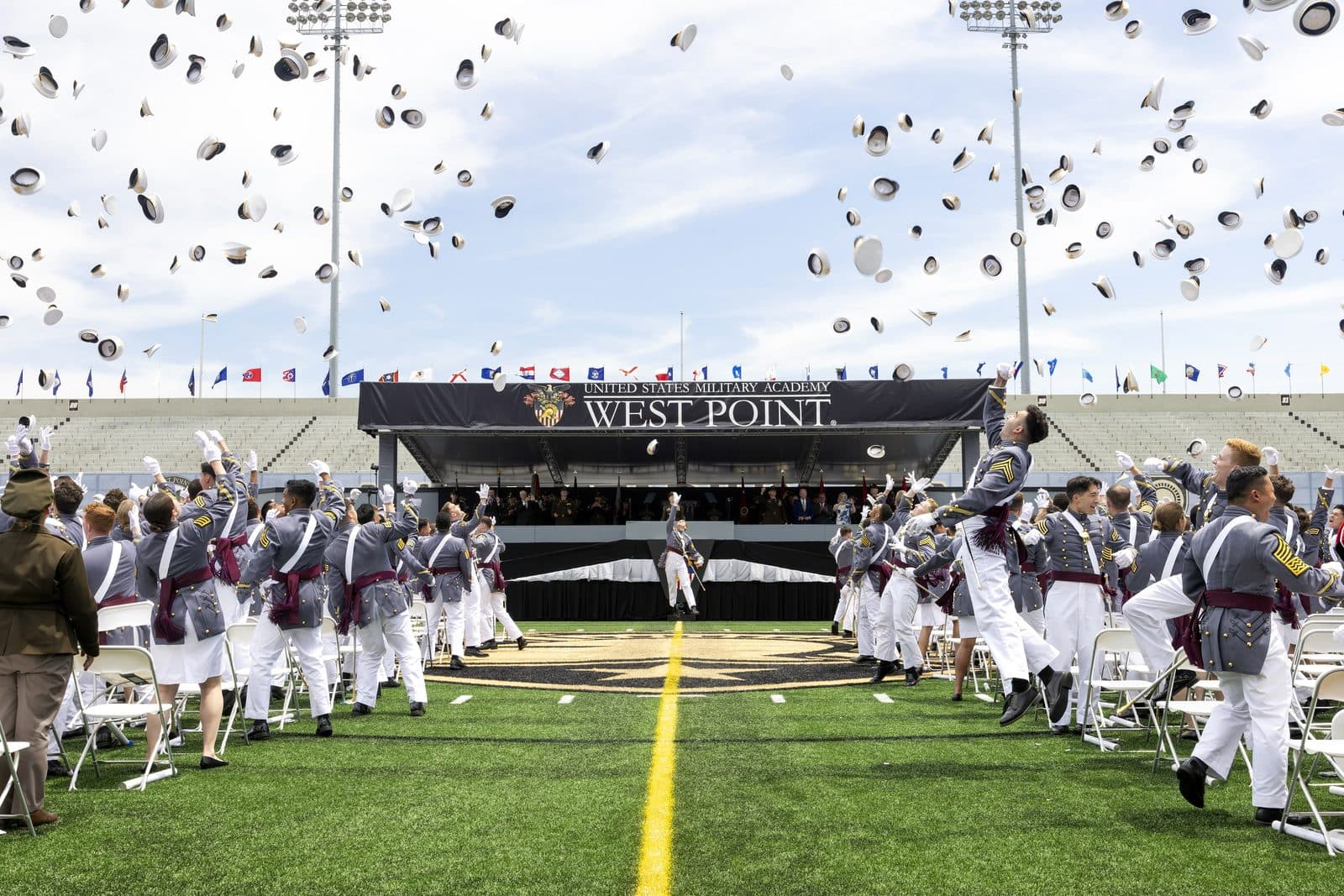 Graduating cadets tossing their hats at Michie Stadium